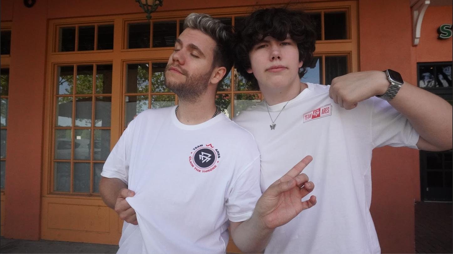 Two Ares members wearing the 2022 collection